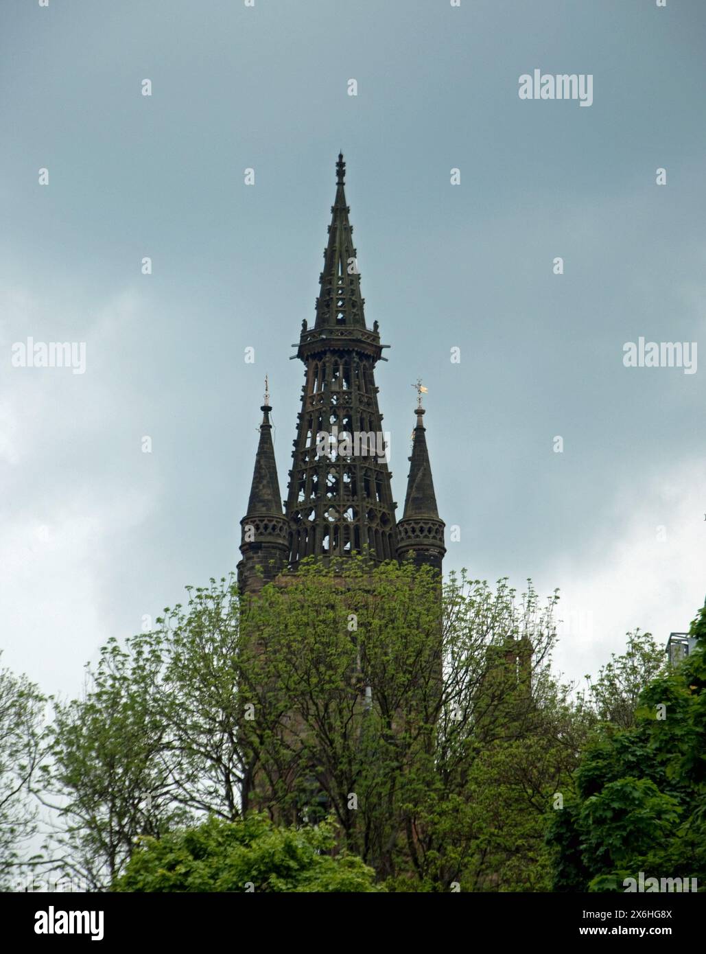 Sir George Gilbert Scott designed the university`s Main Buildings and he planned a lead-covered spire for the tower but died before it was completed. Stock Photo